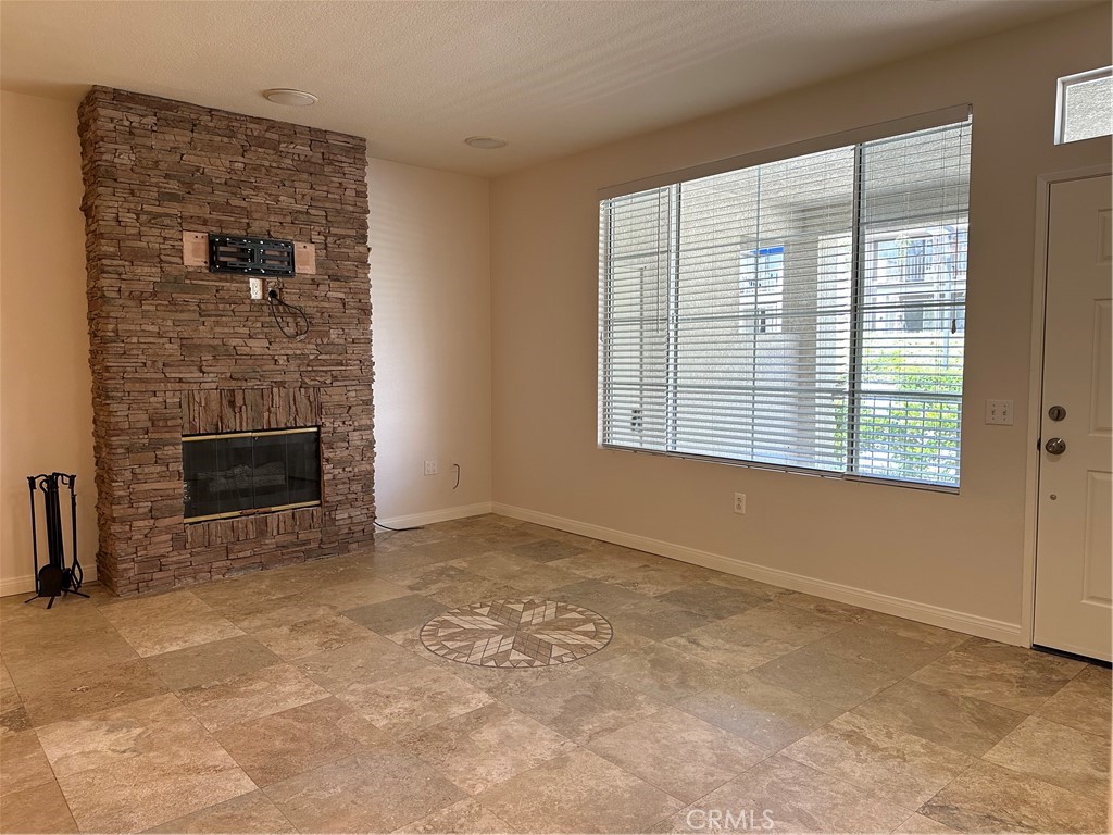 337 Chaumont Circle Lake Forest, CA 92610 - Photo 12 of 32 a view of empty room with a fireplace