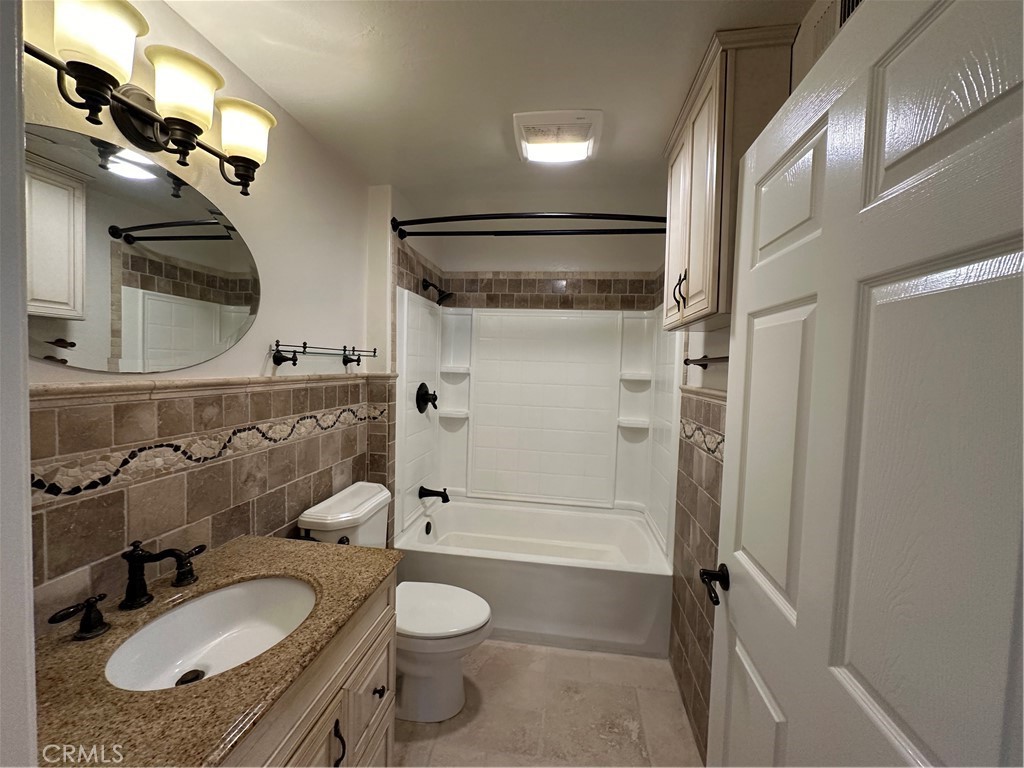 337 Chaumont Circle Lake Forest, CA 92610 - Photo 20 of 32 a bathroom with a granite countertop sink toilet and shower