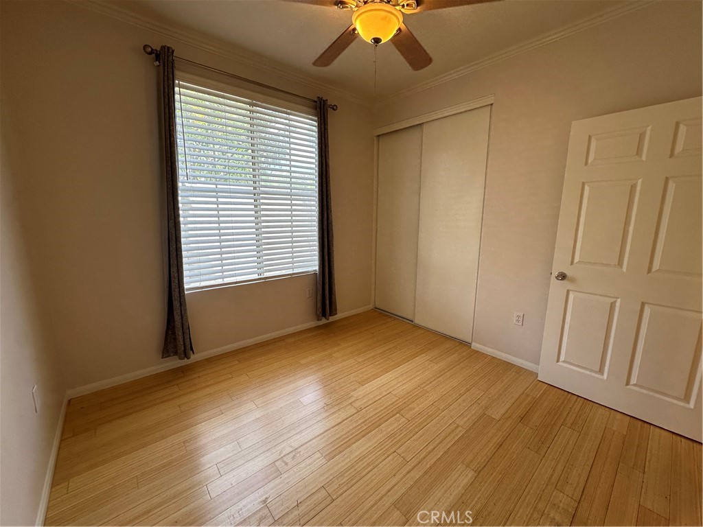 337 Chaumont Circle Lake Forest, CA 92610 - Photo 24 of 32 a view of an empty room with wooden floor and a window