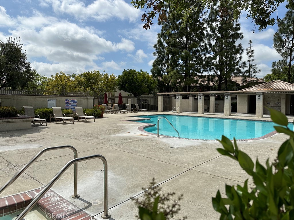 337 Chaumont Circle Lake Forest, CA 92610 - Photo 26 of 32 a view of a swimming pool with a patio and a garden