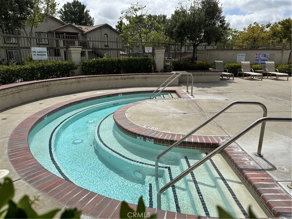 337 Chaumont Circle Lake Forest, CA 92610 - Photo 27 of 32 a view of a swimming pool with a patio