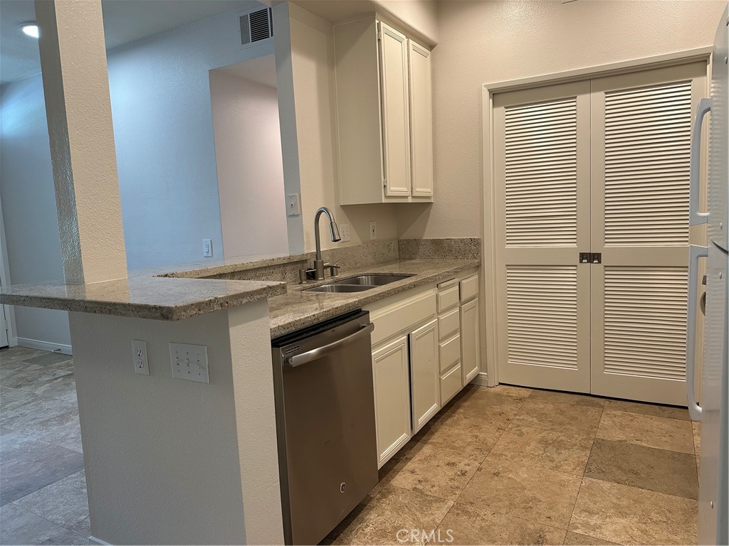 337 Chaumont Circle Lake Forest, CA 92610 - Photo 9 of 32 a kitchen with a sink and cabinets