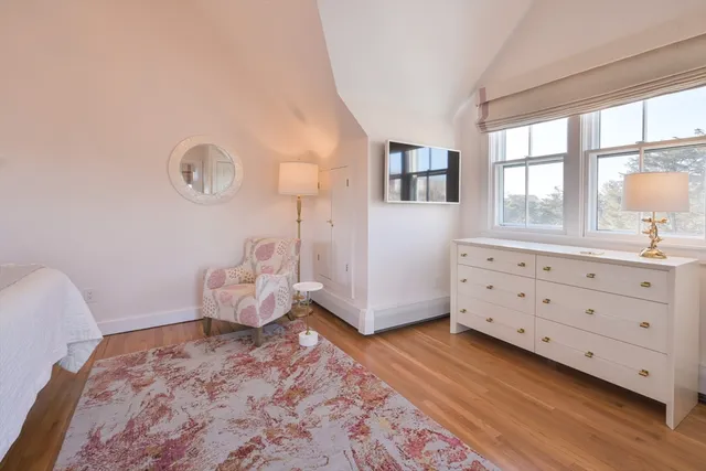 a bed room with a bed and a window