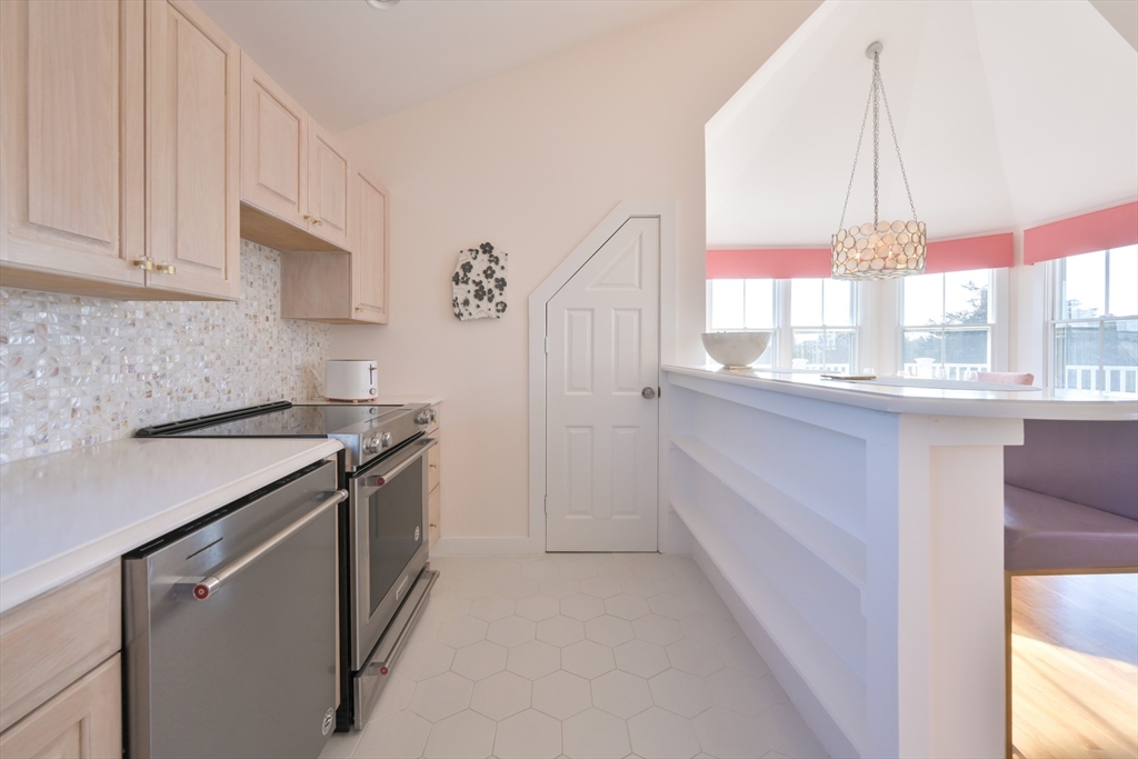 63 Monomoy Road Nantucket, MA 02554 - Photo 29 of 35 a kitchen that has a sink and a stove