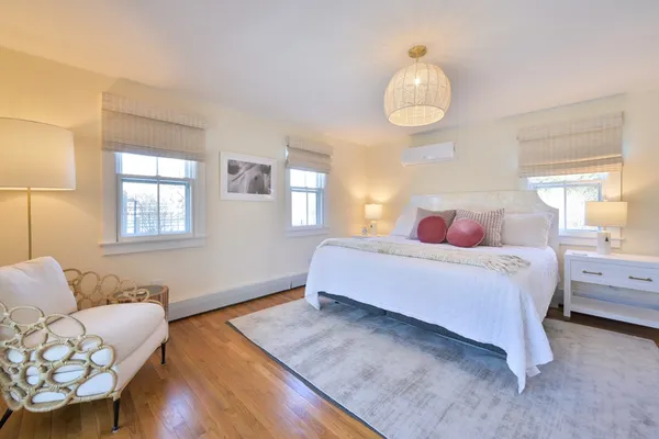 a bedroom with a bed and window