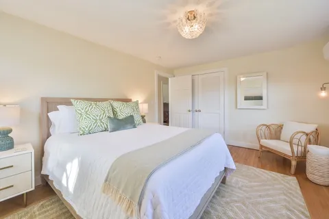 a bedroom with bed and window