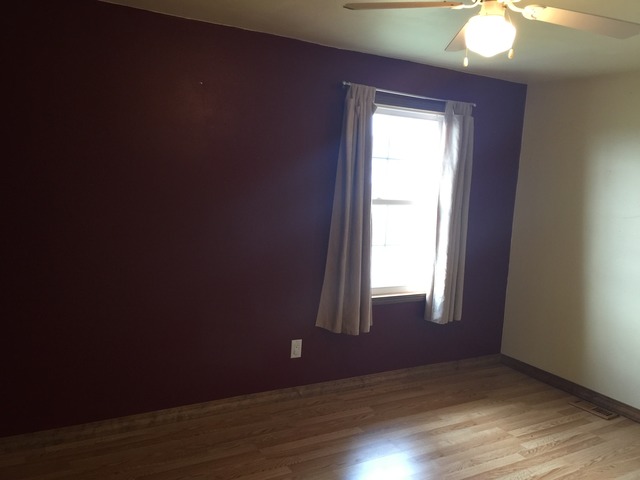 774 Pump Factory Road Amboy, IL 61310 - Photo 11 of 12 an empty room with wooden floor and windows