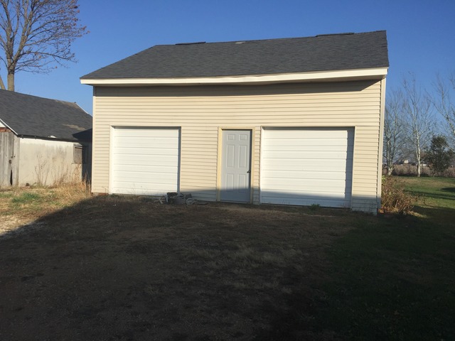774 Pump Factory Road Amboy, IL 61310 - Photo 4 of 12 a front view of a house with a yard