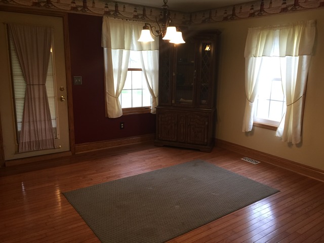 774 Pump Factory Road Amboy, IL 61310 - Photo 7 of 12 an empty room with wooden floor and windows