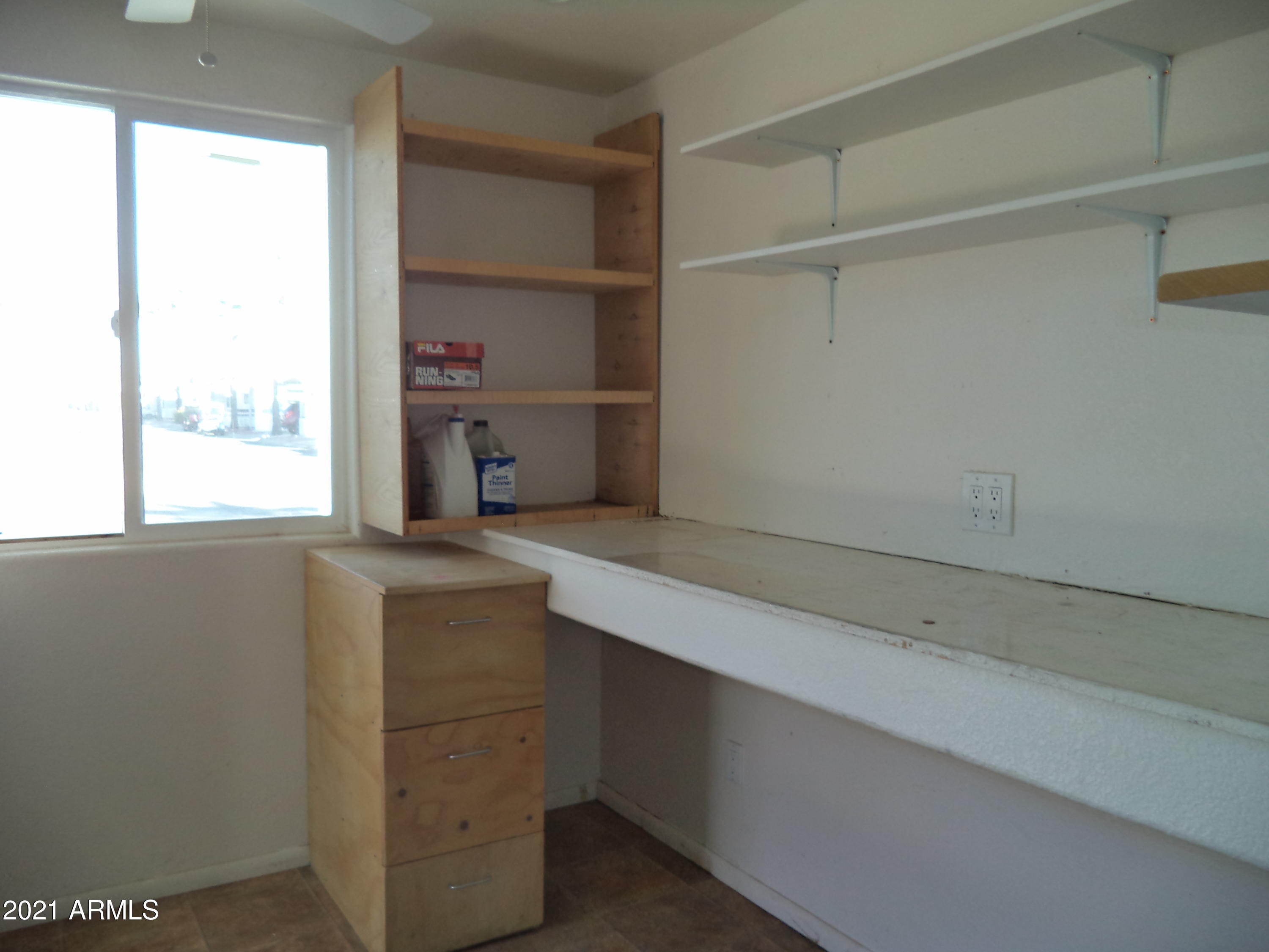 1031 South Prospectors Road, Unit 1031 Apache Junction, AZ 85119 - Photo 5 of 17 Shelving in Shed