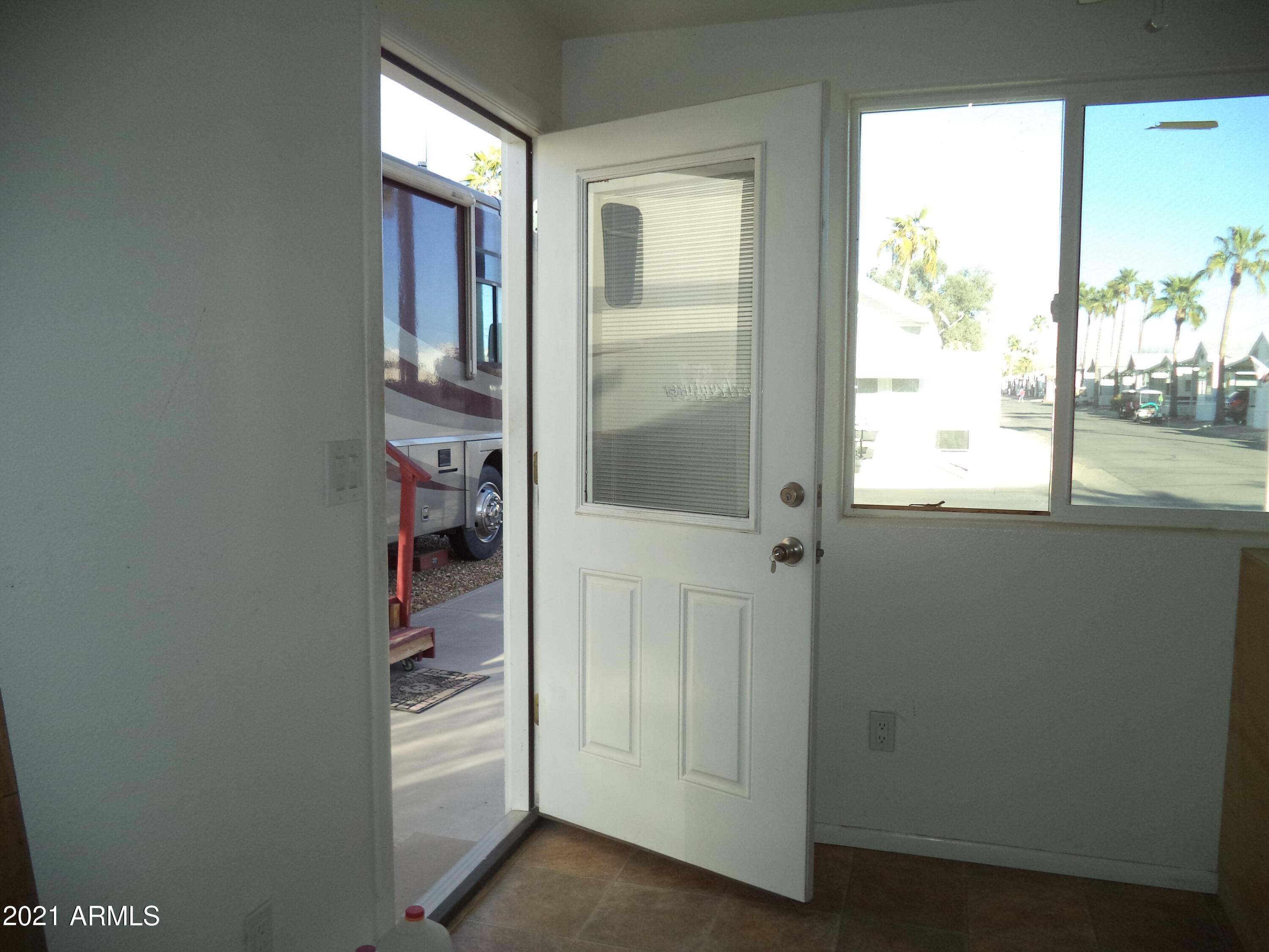 1031 South Prospectors Road, Unit 1031 Apache Junction, AZ 85119 - Photo 6 of 17 Shed Door to Patio
