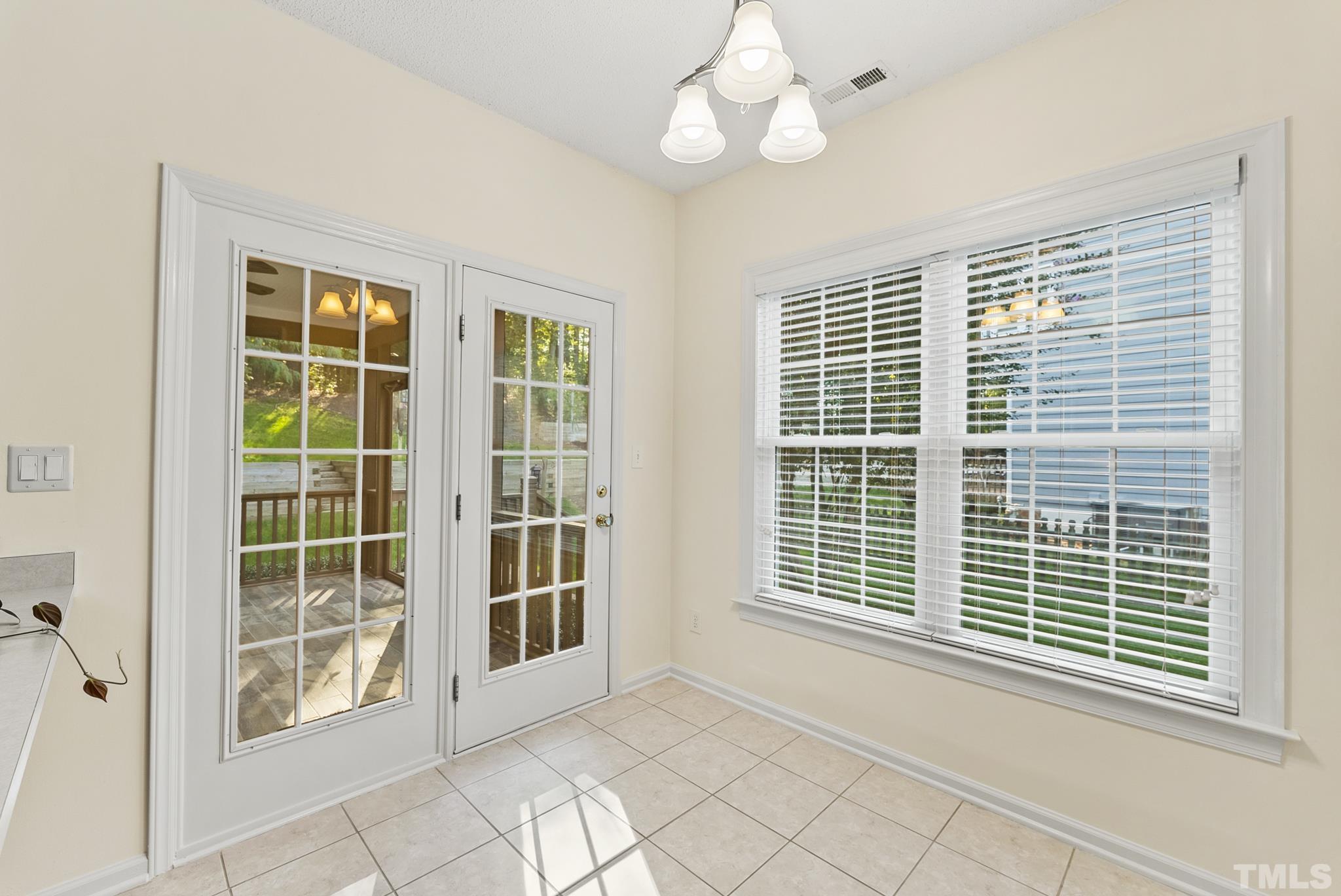 313 Catlin Road Cary, NC 27519 - Photo 12 of 27 a view of an empty room with a window