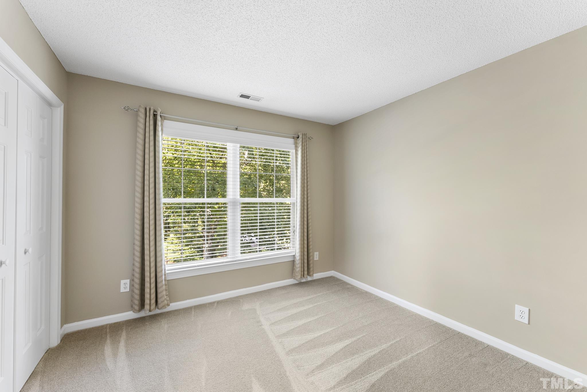 313 Catlin Road Cary, NC 27519 - Photo 20 of 27 a view of an empty room with a window