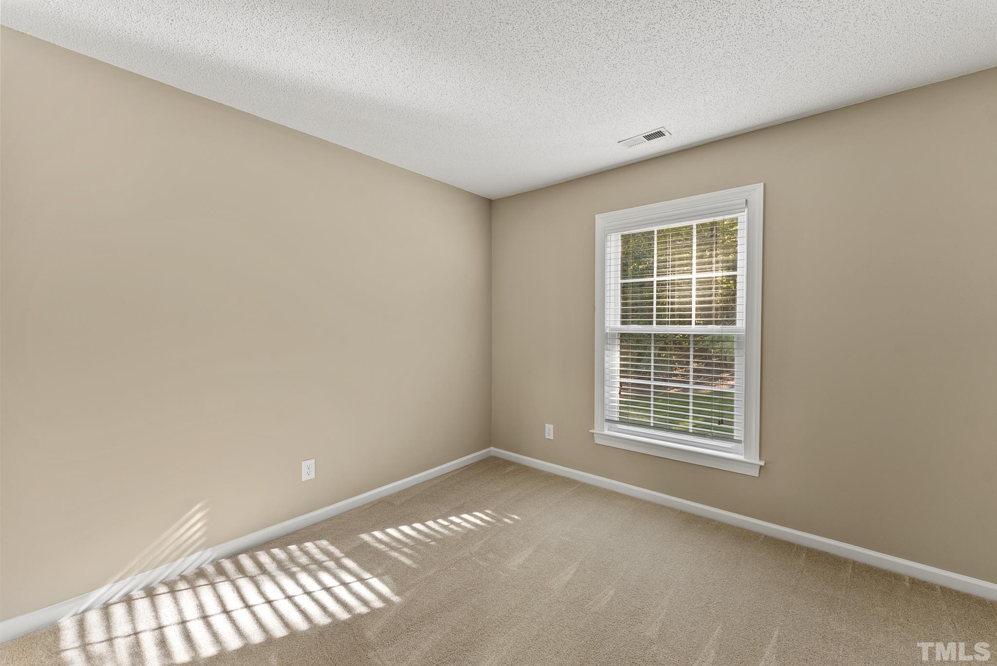 313 Catlin Road Cary, NC 27519 - Photo 22 of 27 an empty room with a window