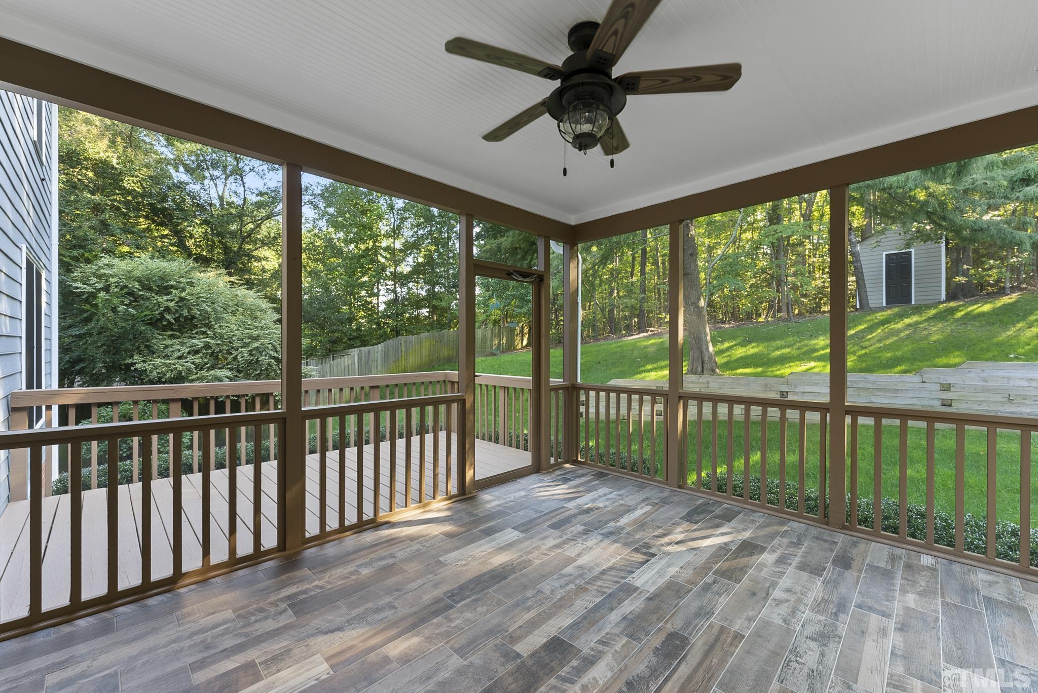 313 Catlin Road Cary, NC 27519 - Photo 23 of 27 a view of a porch with wooden floor and outdoor space