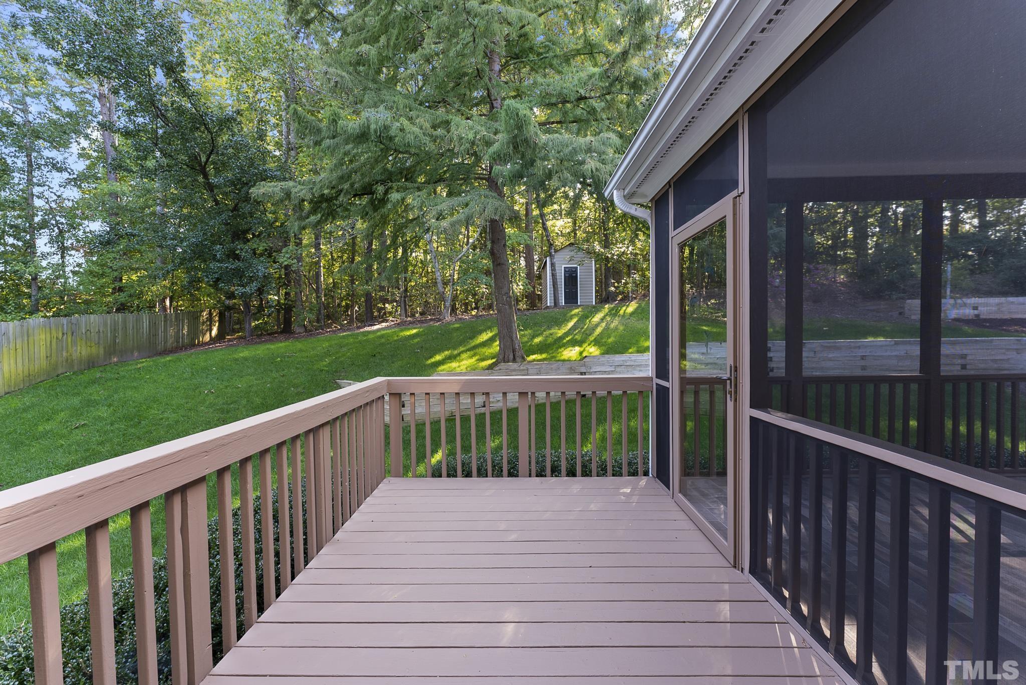 313 Catlin Road Cary, NC 27519 - Photo 25 of 27 a view of a deck with wooden floor and fence
