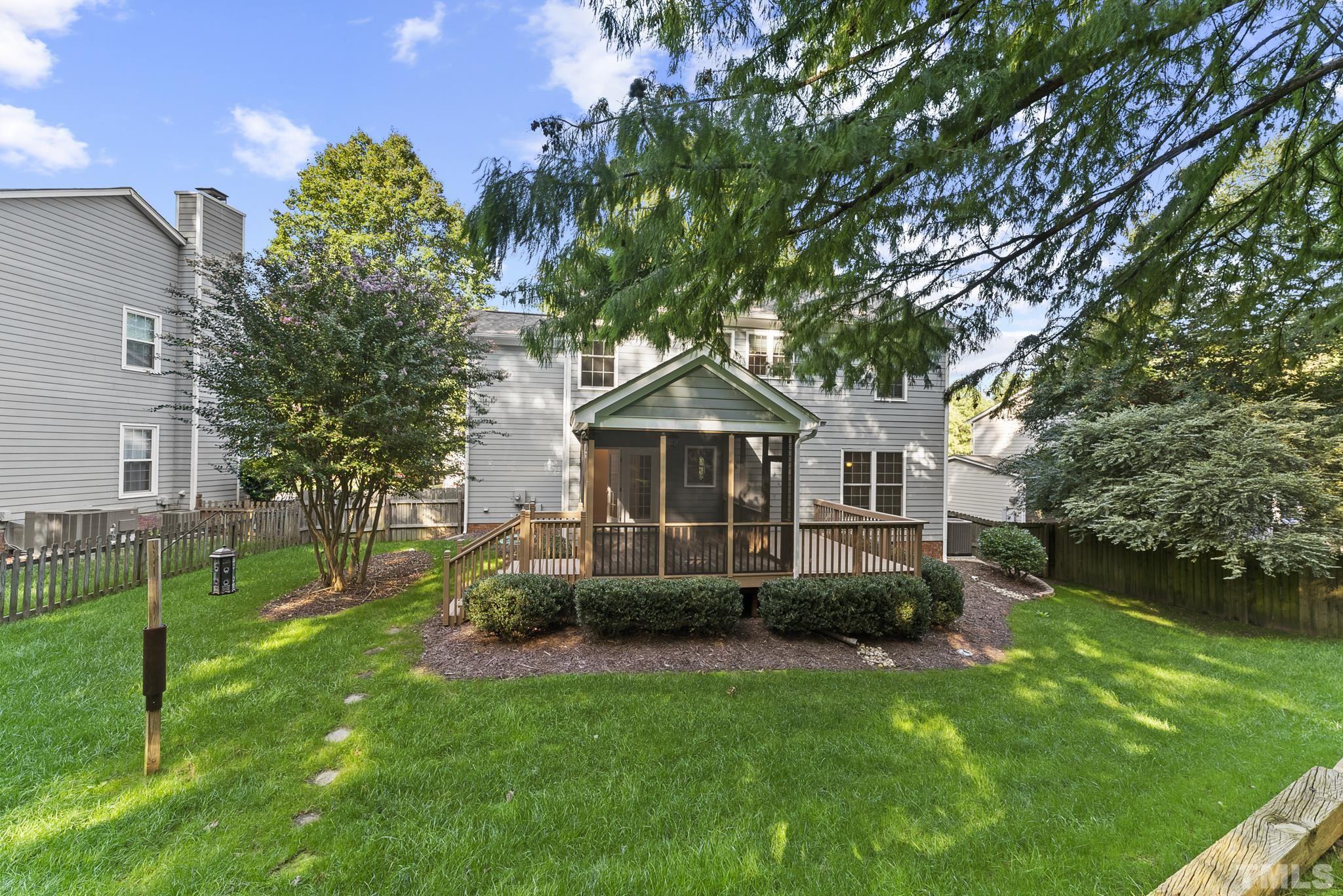 313 Catlin Road Cary, NC 27519 - Photo 27 of 27 a front view of a house with a garden and trees