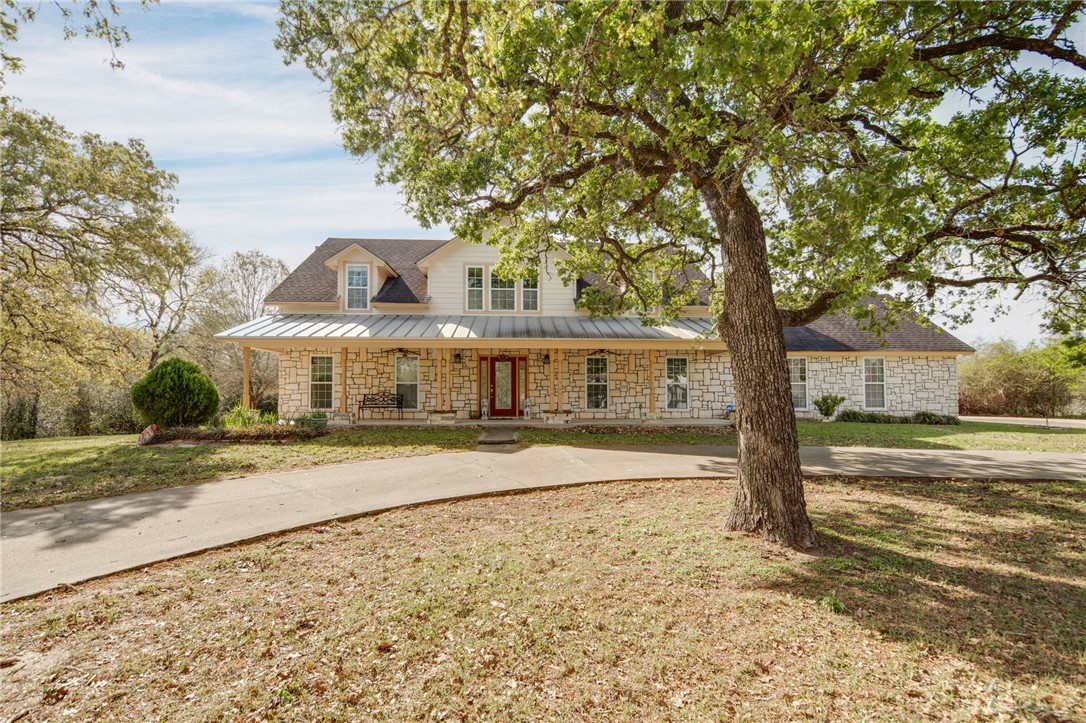 209 Ranchette Court Bryan, TX 77808 - Photo 1 of 37 a view of a large trees in front of a house