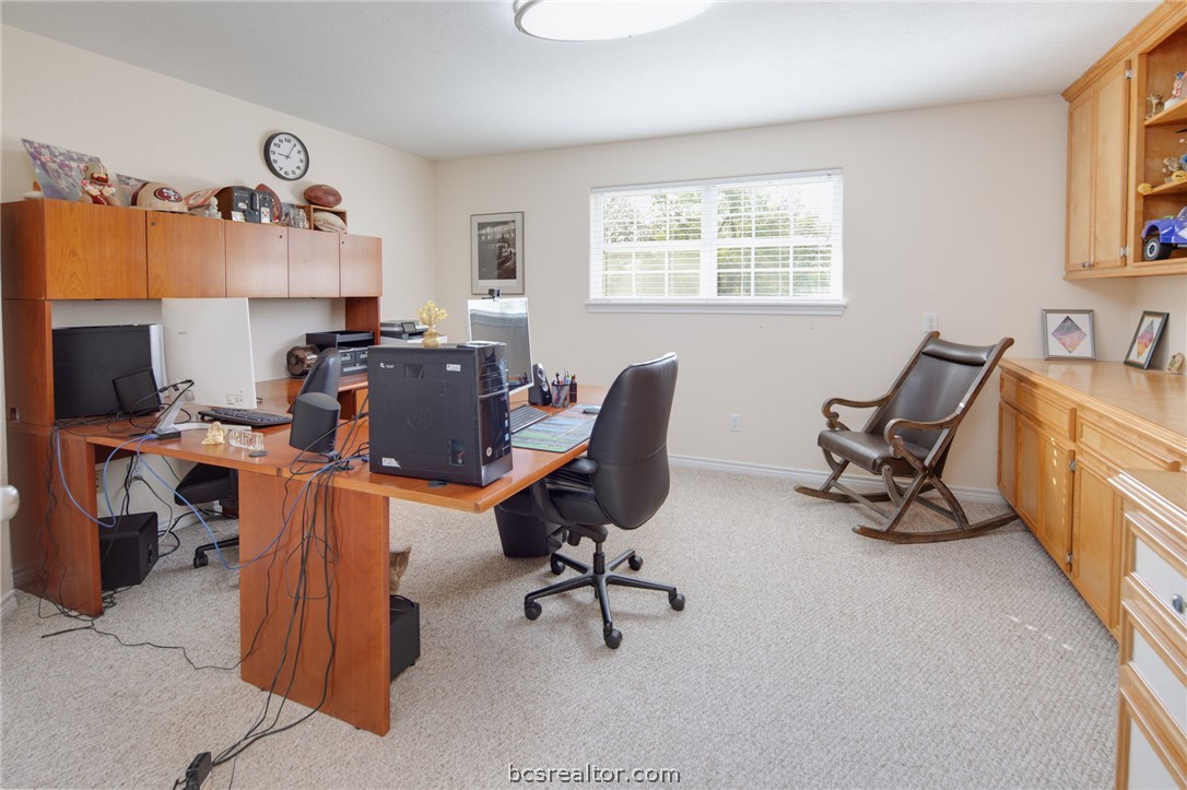 209 Ranchette Court Bryan, TX 77808 - Photo 23 of 37 a view of a workspace with furniture and a window