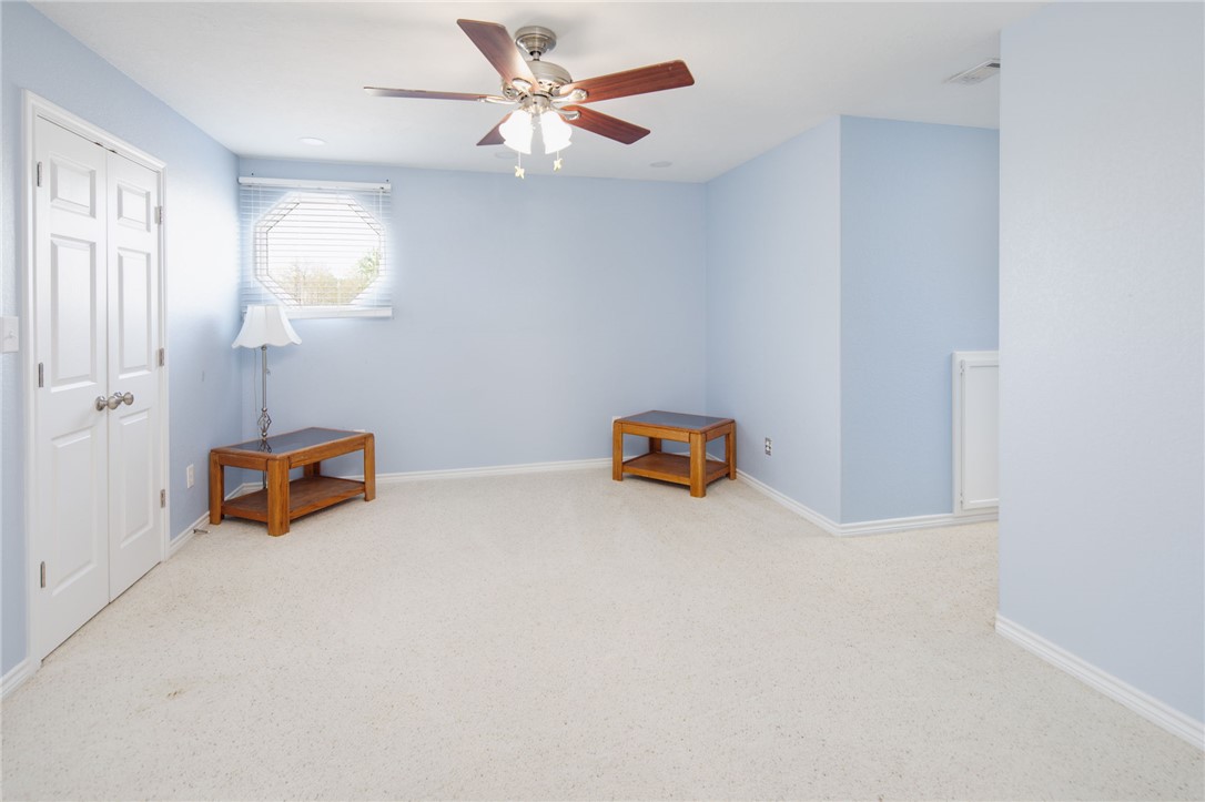 209 Ranchette Court Bryan, TX 77808 - Photo 25 of 37 an empty room with windows and fan