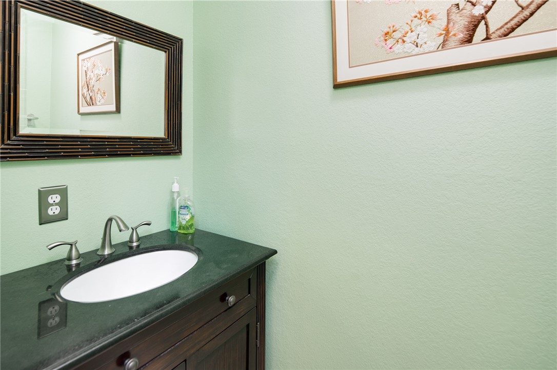 209 Ranchette Court Bryan, TX 77808 - Photo 26 of 37 a bathroom with a sink and a mirror
