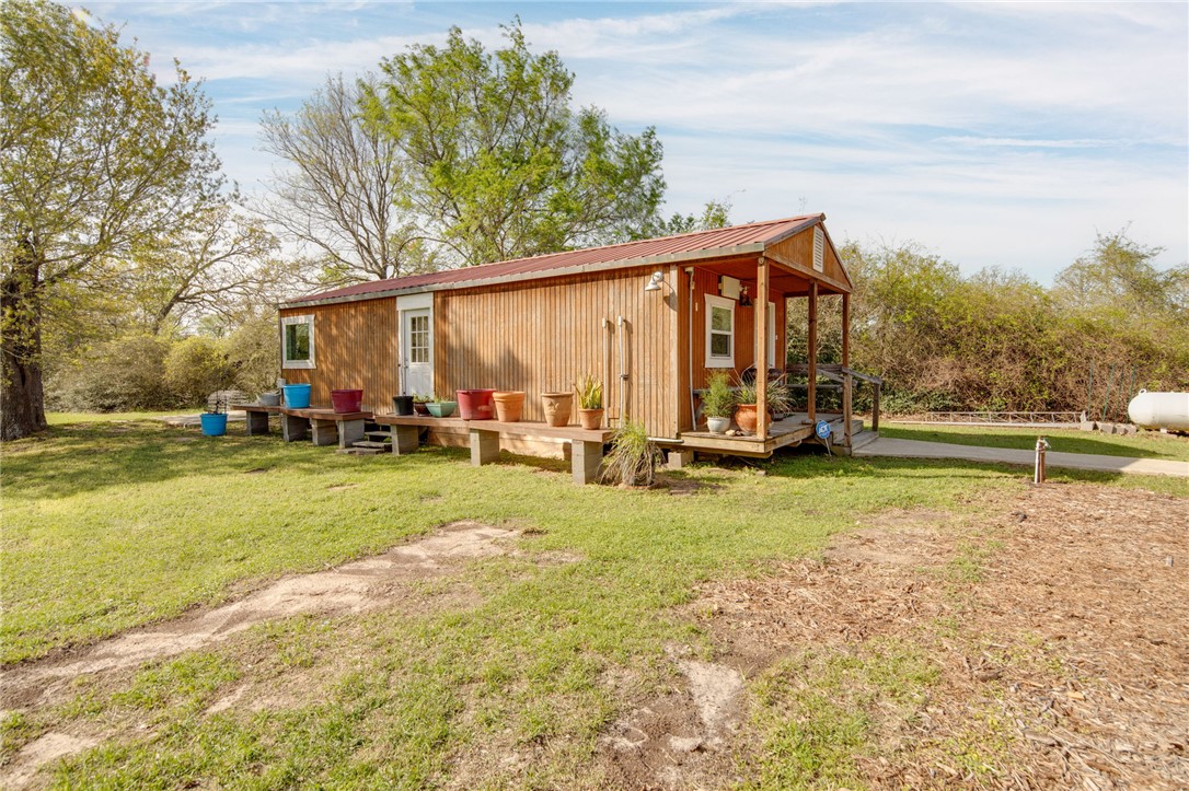 209 Ranchette Court Bryan, TX 77808 - Photo 30 of 37 a view of a house with a yard