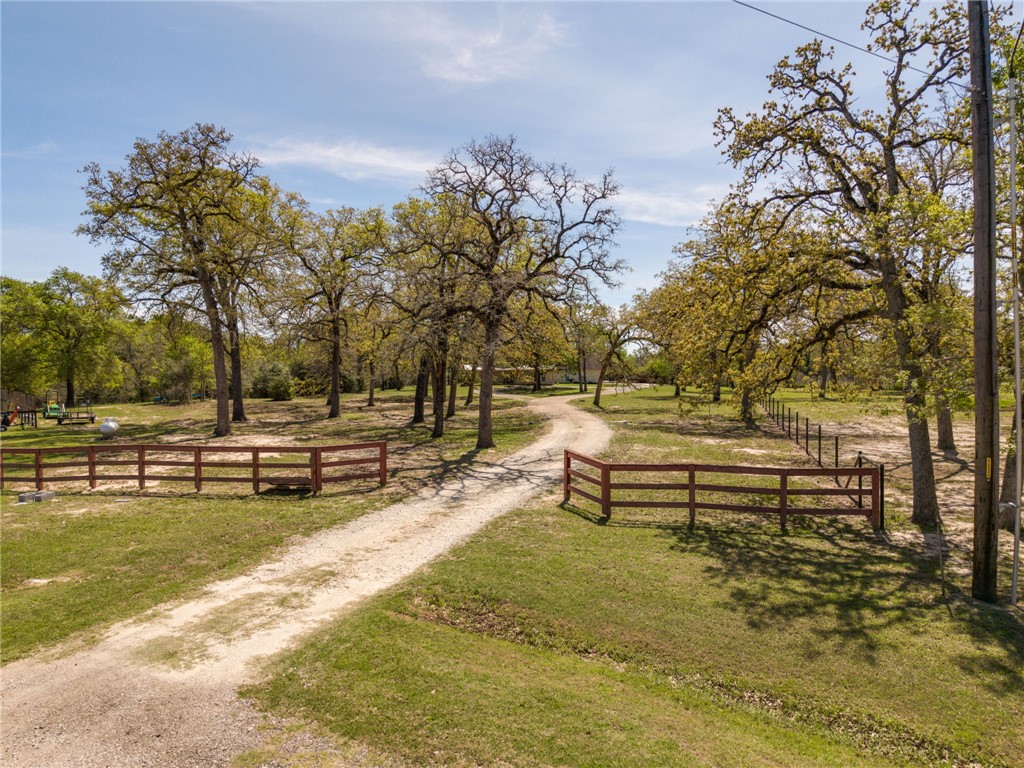 209 Ranchette Court Bryan, TX 77808 - Photo 37 of 37 a view of swimming pool with outdoor seating and trees