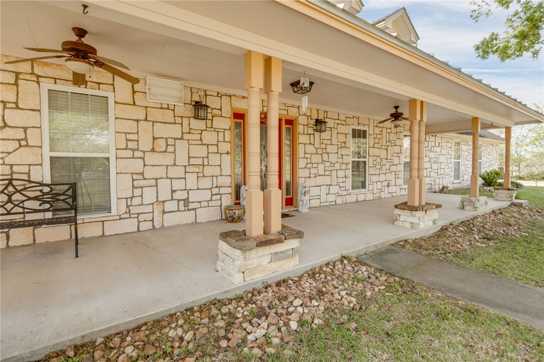 209 Ranchette Court Bryan, TX 77808 - Photo 6 of 37 a view of a porch with a table and chairs