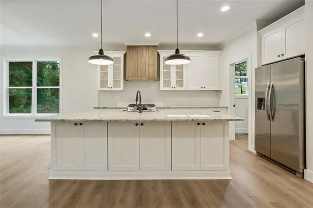 a view of a kitchen with a stove cabinets and a wooden floor