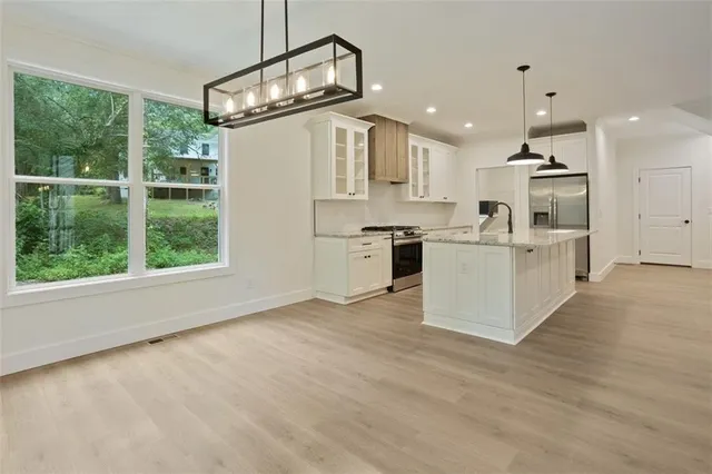 a view of empty room with windows