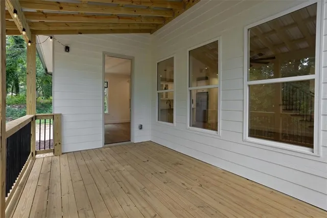 a bathroom with a granite countertop sink mirror vanity and toilet