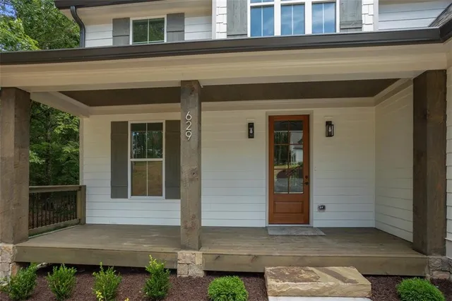 a front view of a house with a garage