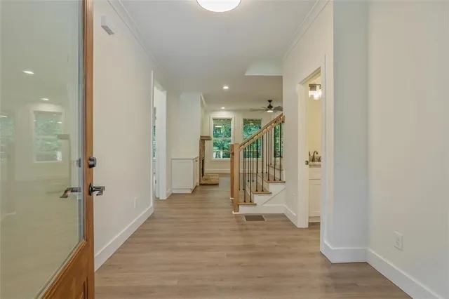 a view of entryway with wooden floor and window