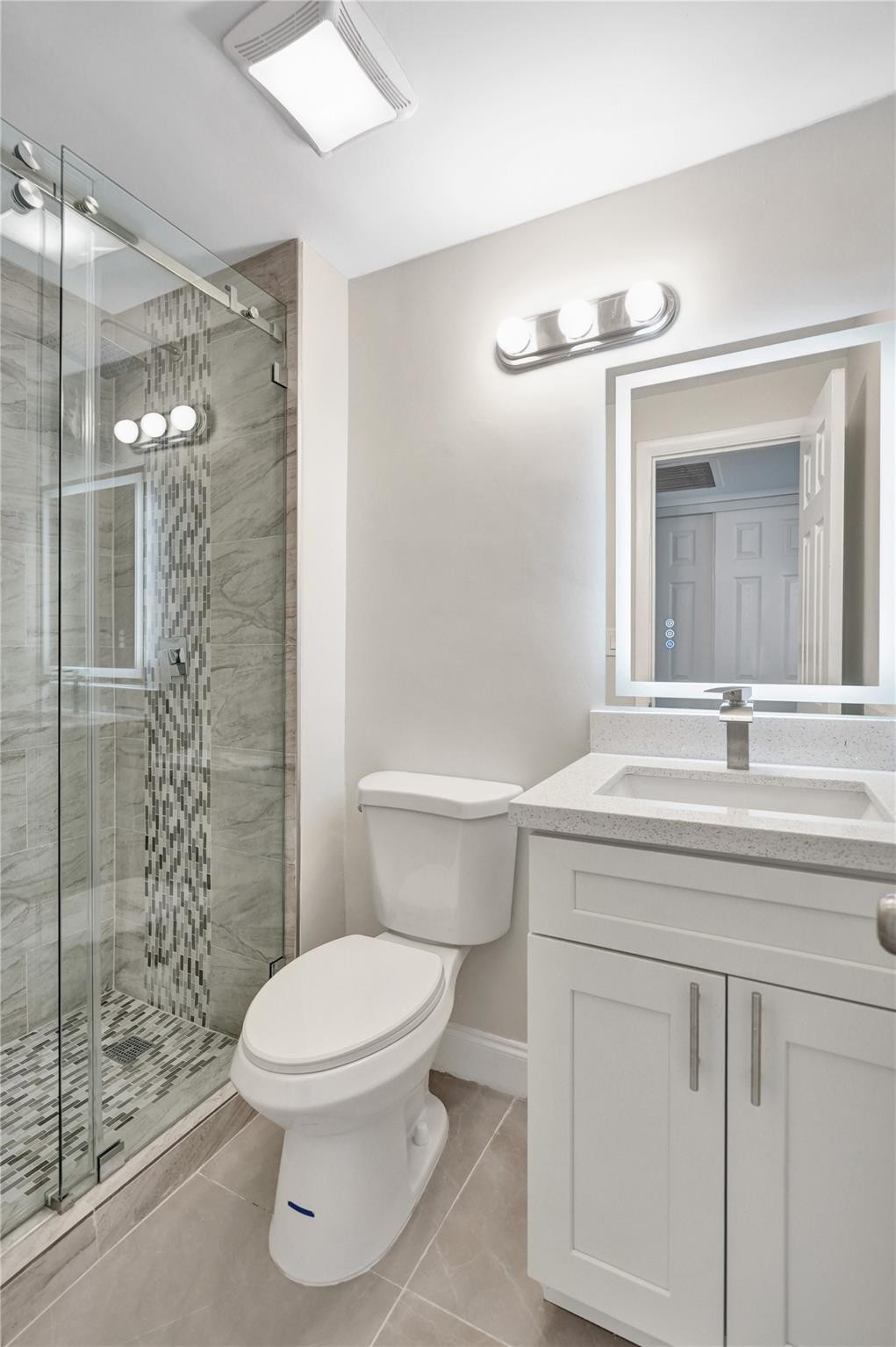 4222 Inverrary Boulevard, Unit 4810 Lauderhill, FL 33319 - Photo 51 of 63 a bathroom with a sink toilet and shower