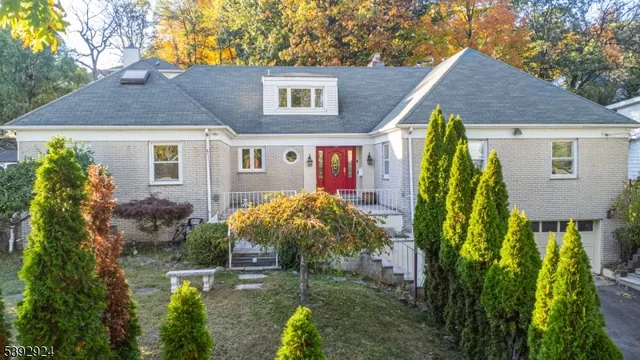 a view of a house with a yard and plants