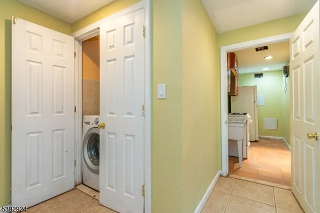 a view of a bathroom with tub and shower