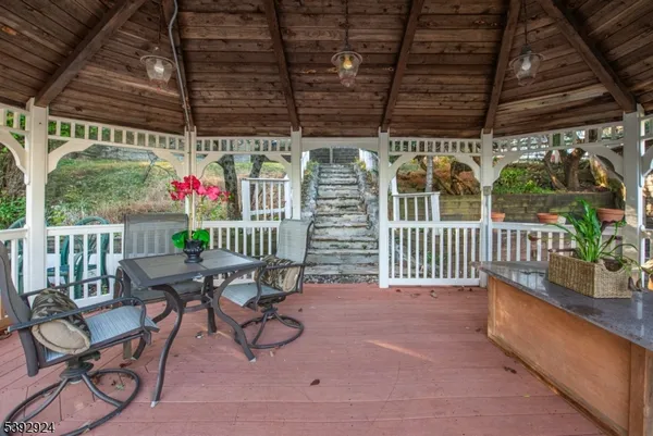 a backyard of a house with yard and outdoor seating
