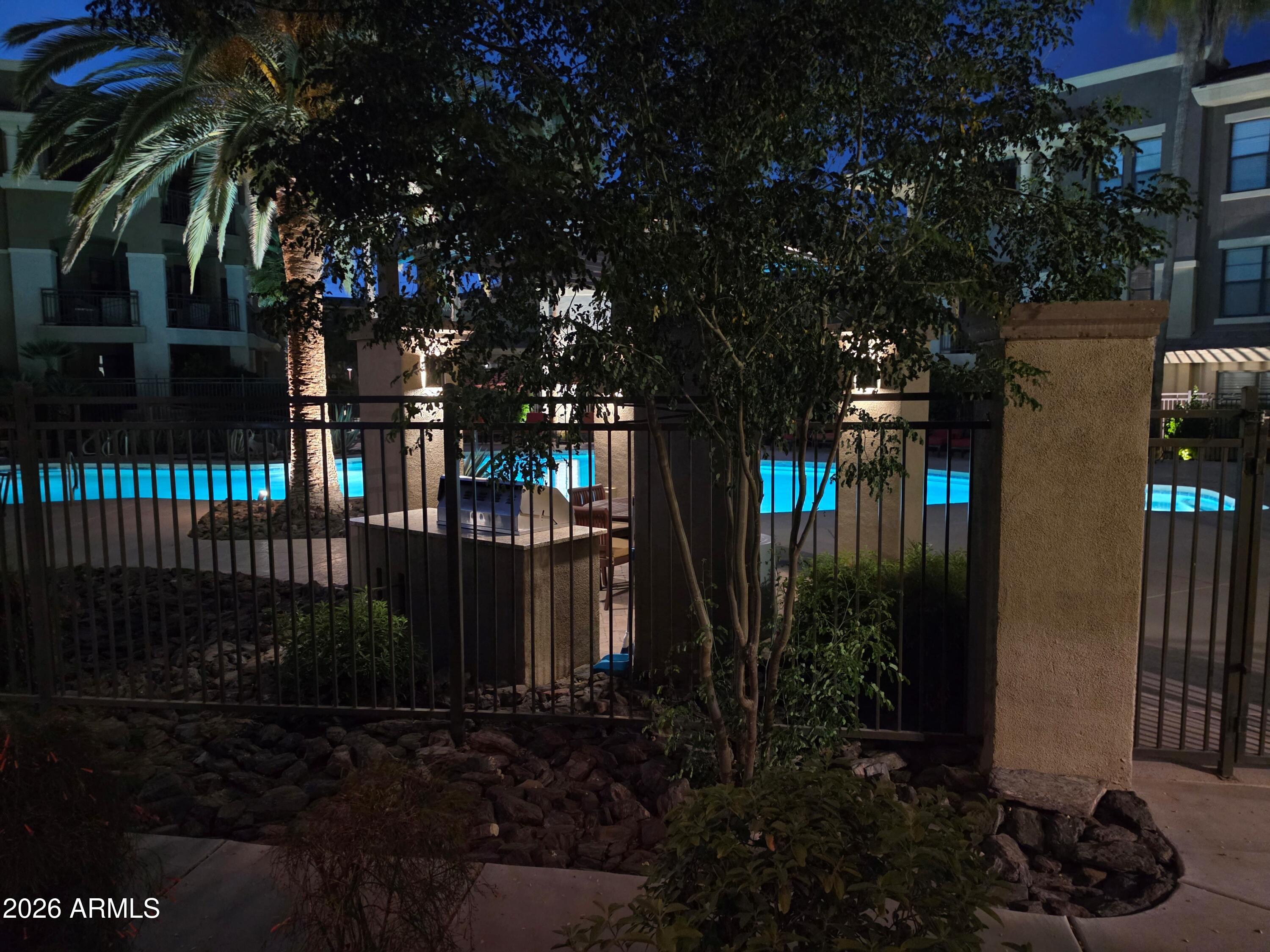 7601 East Indian Bend Road, Unit 1017 Scottsdale, AZ 85250 - Photo 33 of 49 a view of a house with a yard