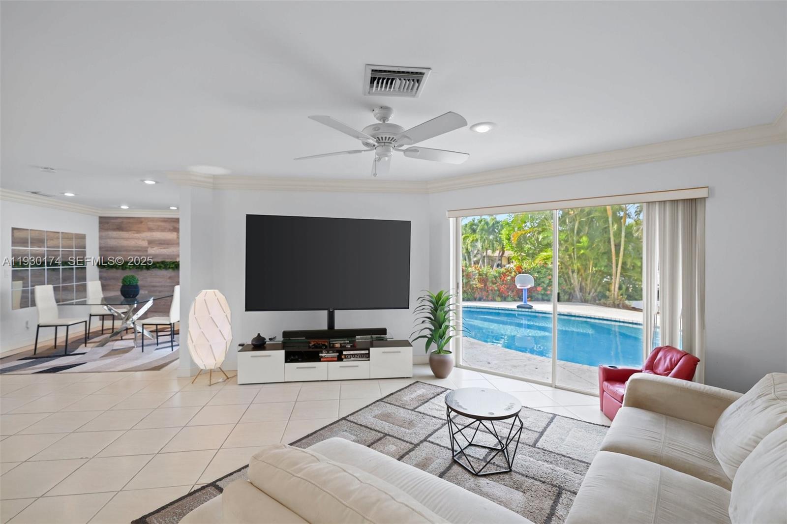 4841 Northeast 29th Avenue Lighthouse Point, FL 33064 - Photo 15 of 50 a living room with furniture and a large window