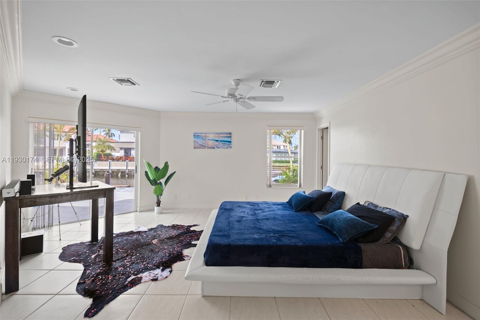4841 Northeast 29th Avenue Lighthouse Point, FL 33064 - Photo 18 of 50 a living room with a couch and a potted plant