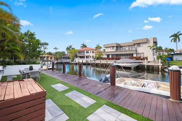 a view of yard from deck having patio