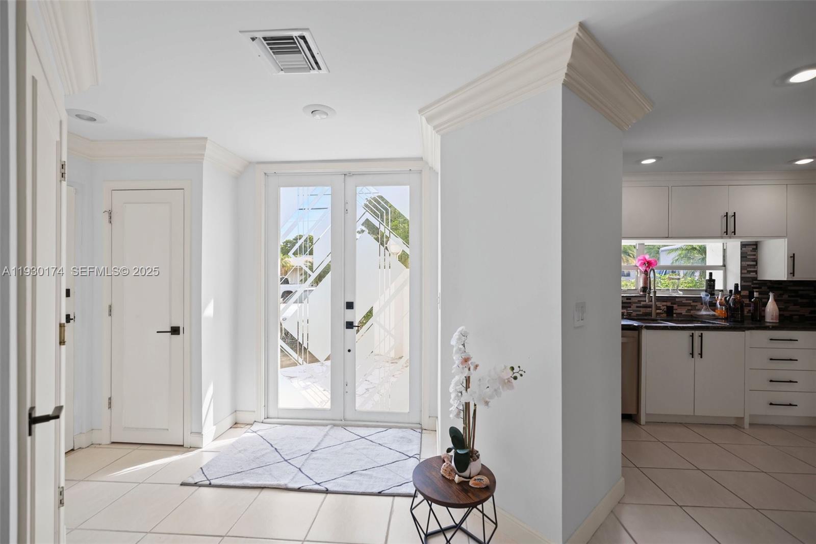 4841 Northeast 29th Avenue Lighthouse Point, FL 33064 - Photo 50 of 50 a living room with stainless steel appliances kitchen island granite countertop furniture a rug and a window