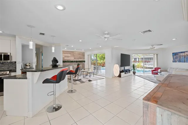 a room with lots of chairs and mirrors