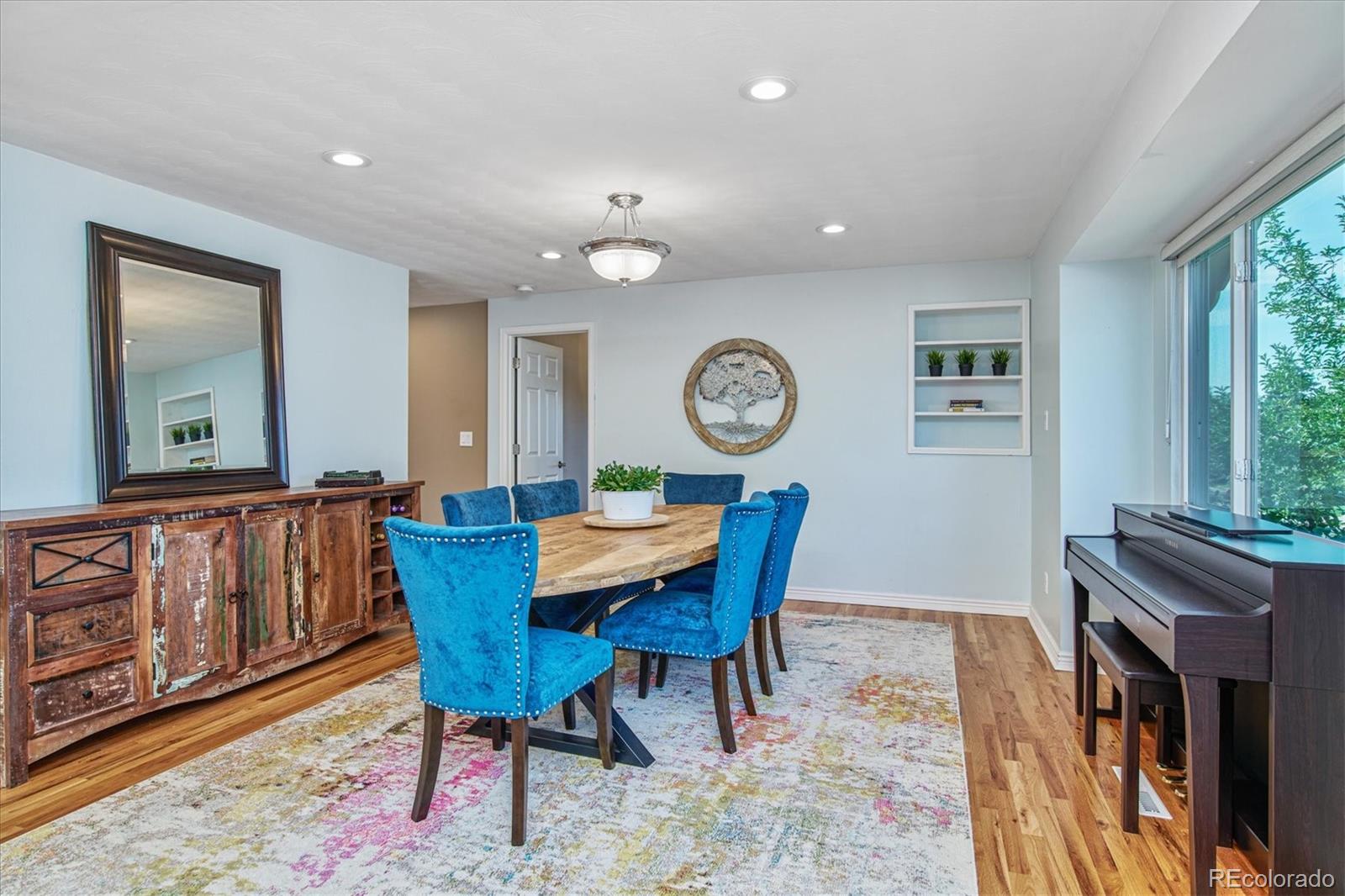 6526 South Elizabeth Way Centennial, CO 80121 - Photo 12 of 38 a view of a dining room with furniture and a large window