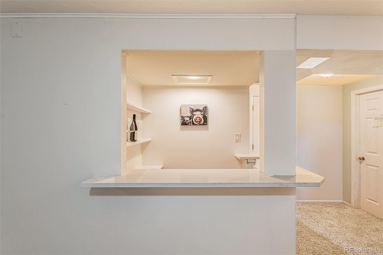 6526 South Elizabeth Way Centennial, CO 80121 - Photo 18 of 38 a bathroom with a sink and a mirror