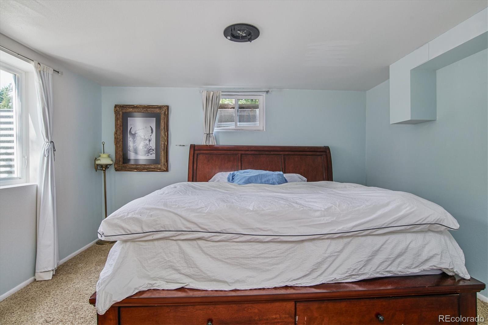 6526 South Elizabeth Way Centennial, CO 80121 - Photo 23 of 38 a bedroom with a bed and window