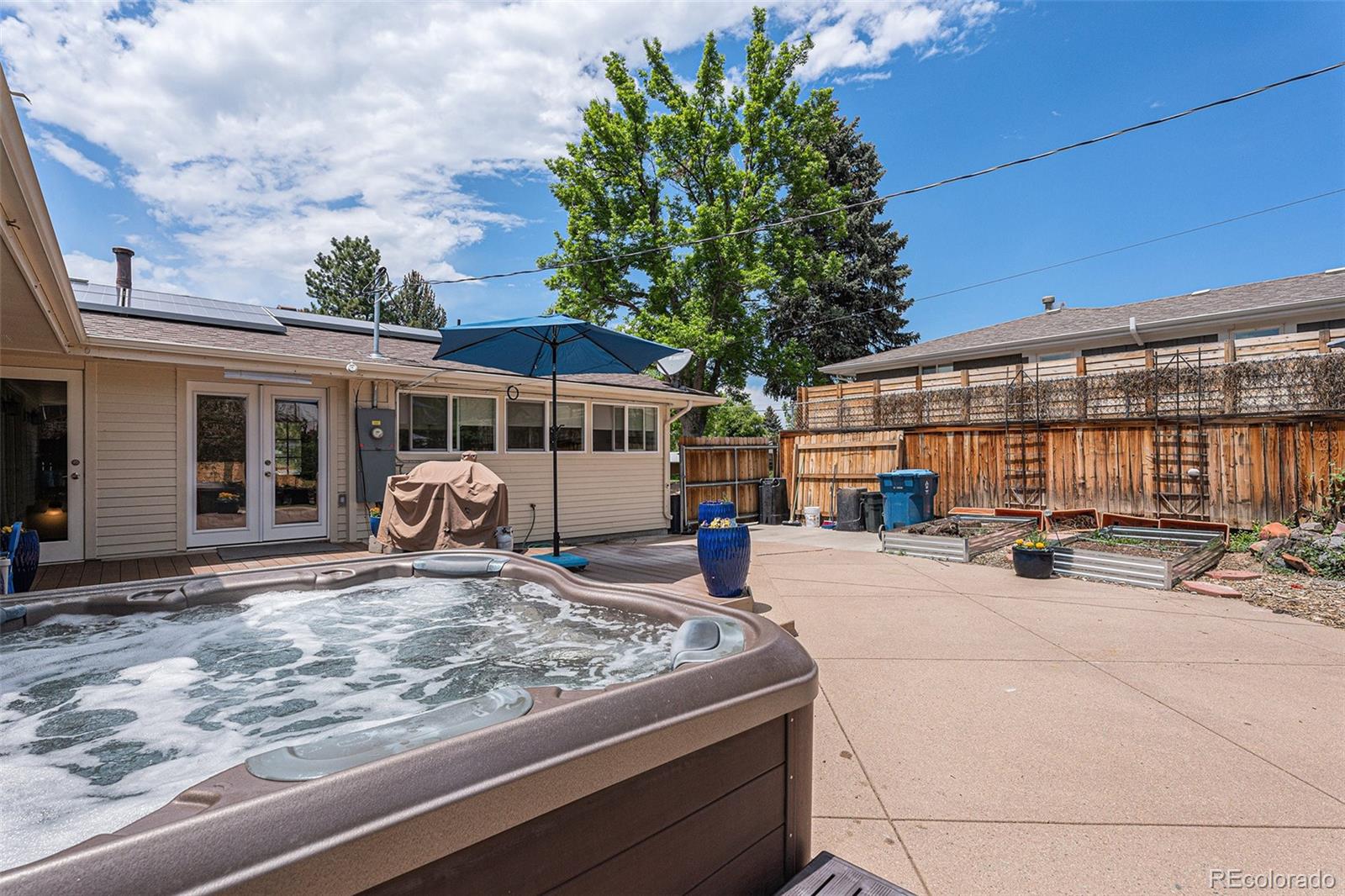 6526 South Elizabeth Way Centennial, CO 80121 - Photo 28 of 38 a view of a house with backyard porch and sitting area