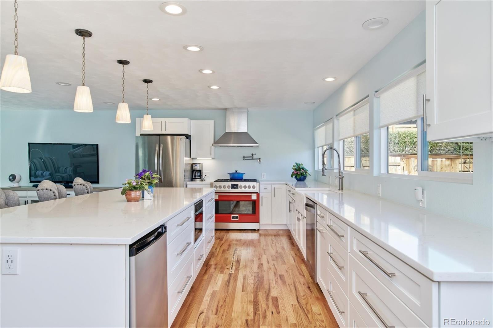 6526 South Elizabeth Way Centennial, CO 80121 - Photo 4 of 38 a kitchen with a sink and wooden floor