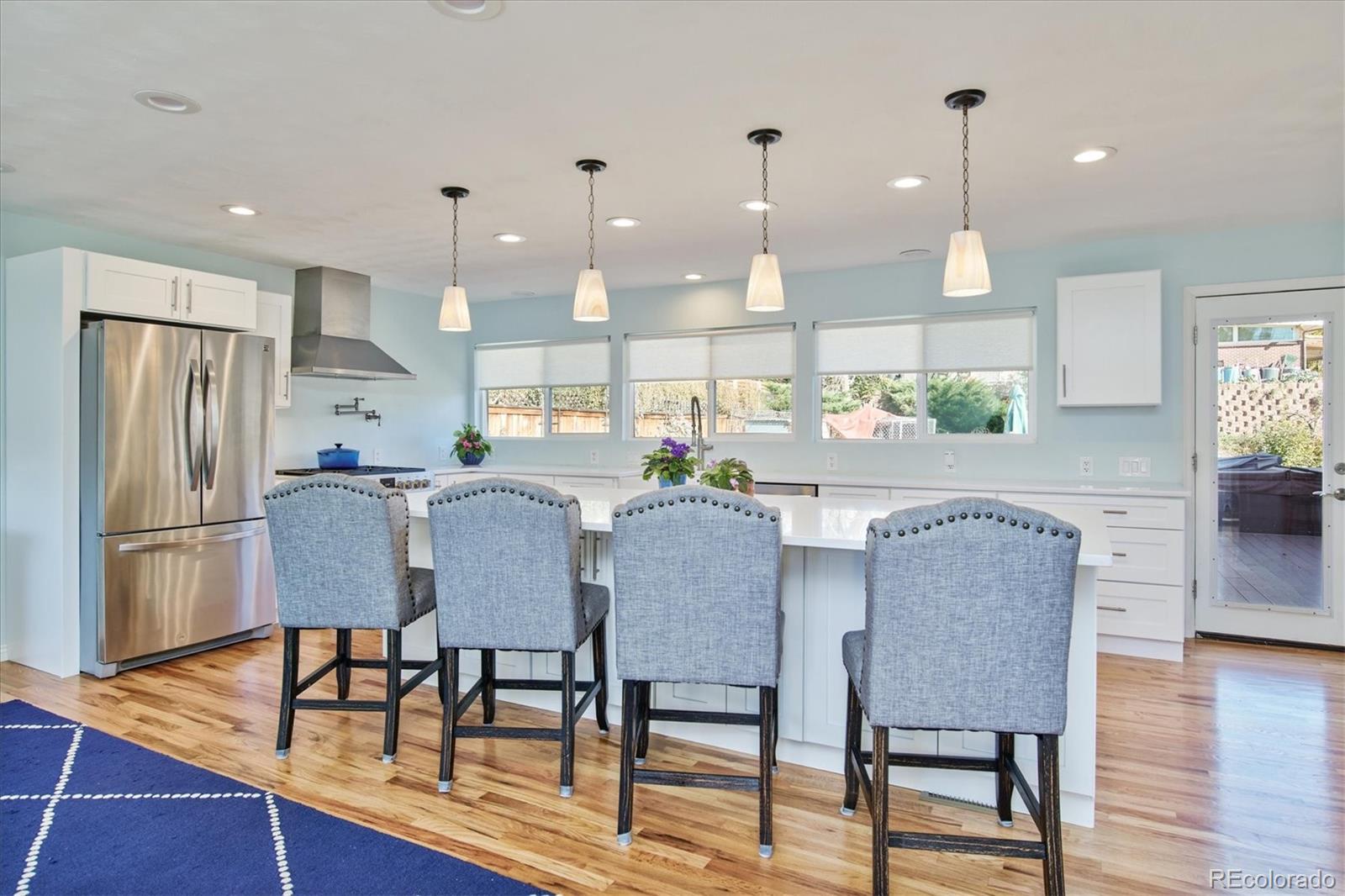 6526 South Elizabeth Way Centennial, CO 80121 - Photo 7 of 38 a dining room with furniture and wooden floor