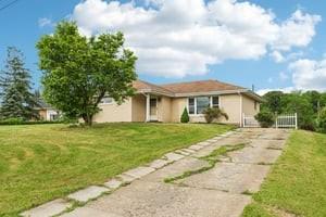 200 Edgewood Street Aliquippa, PA 15001 - Photo 3 of 47 a front view of a house with a garden